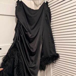 One shoulder black formal dress, with tags. Cute slit and feather details